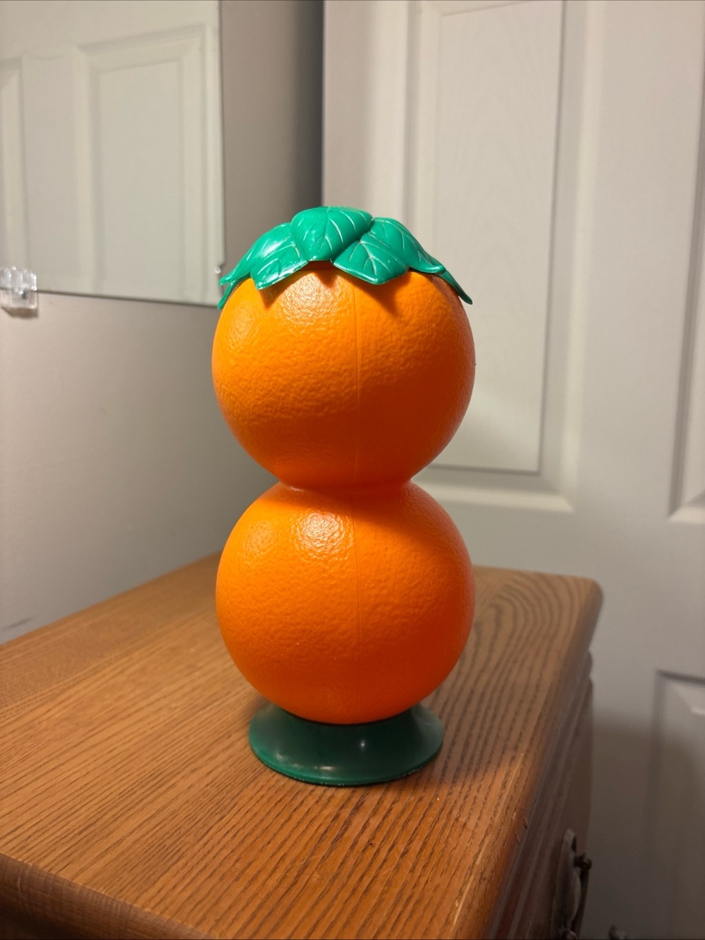 Decorative Orange Stack Accent with Green Leaf Top